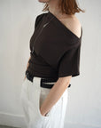 Unbalance tuck top