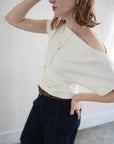 Unbalance tuck top