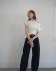 Unbalance tuck top