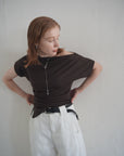 Unbalance tuck top