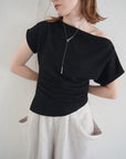 Unbalance tuck top
