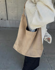 Suède round taught bag