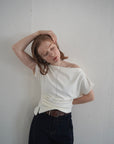 Unbalance tuck top
