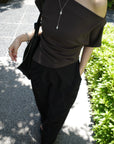 Unbalance tuck top