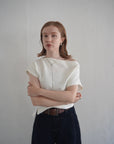 Unbalance tuck top
