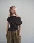 Unbalance tuck top