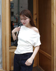 Unbalance tuck top