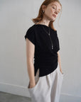 Unbalance tuck top
