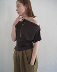 Unbalance tuck top