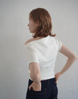 Unbalance tuck top