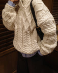 Asymmetric cable knit