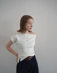 Unbalance tuck top