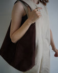Suède round taught bag