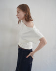 Unbalance tuck top