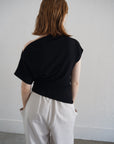 Unbalance tuck top