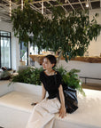 Unbalance tuck top