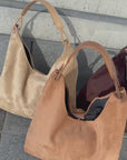 Suède round taught bag