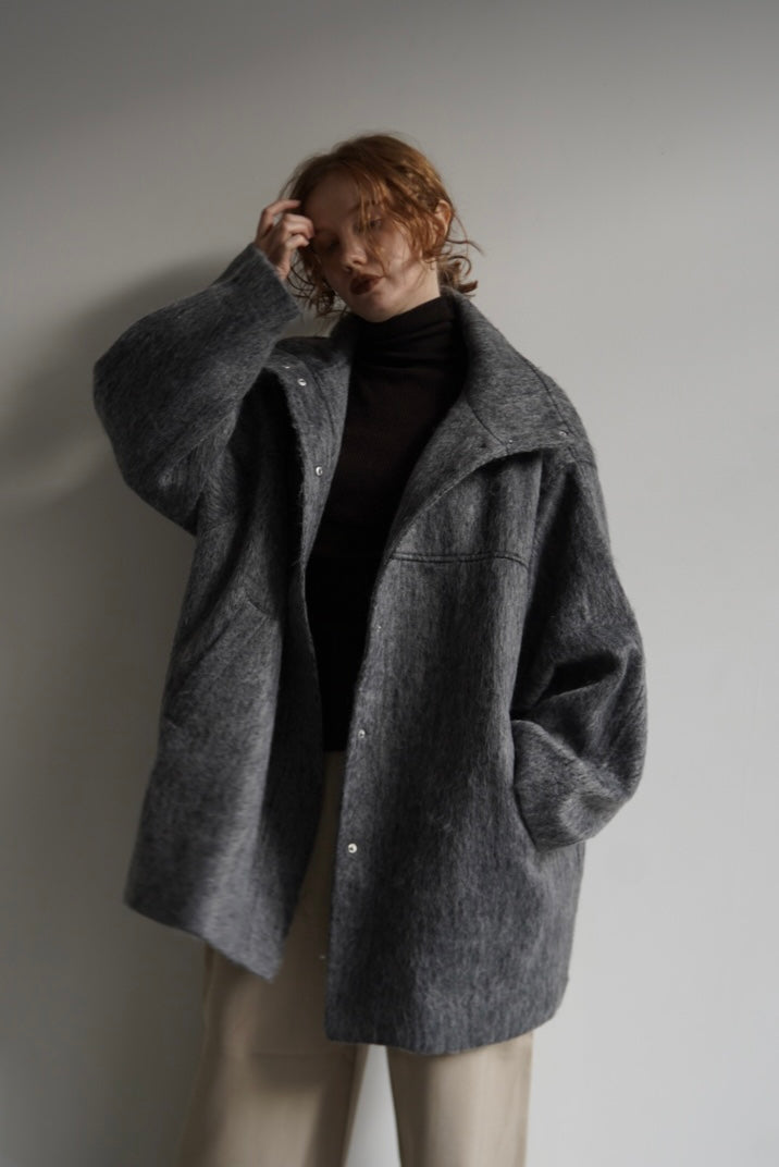 Stand shaggy over coat